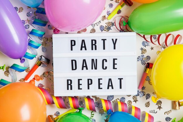 Party celebration background with party dance repeat message on
a lightbox