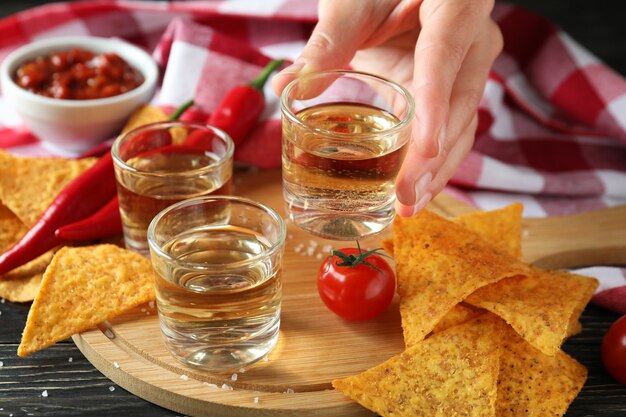 Party concept with tequila, guacamole and chips