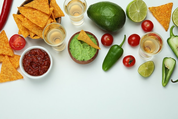 Party concept with tequila, guacamole and chips