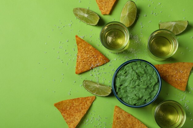 Photo party concept with tequila, guacamole and chips