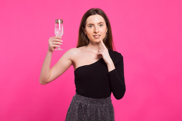 party drinks holidays christmas and people concept smiling woman in evening dress with glass