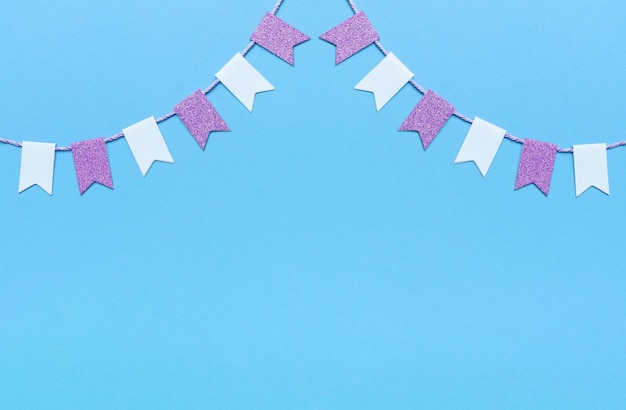 party flags garlands set on pink background holiday design