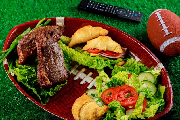 Party food plate for celebrate and watching american football game.