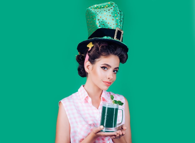 Party girl on Patricks Day pinup woman in green style with beer.