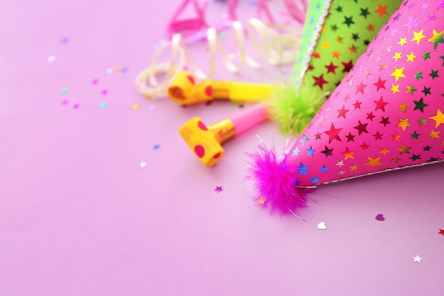 Party hats on pink background