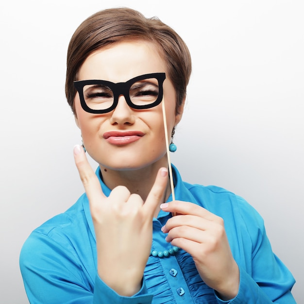 Party image. Playful young women holding a party glasses. Ready for good time.