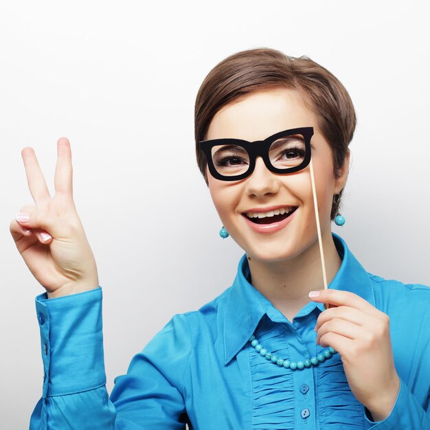 Party image Playful young women holding a party glasses Ready for good time