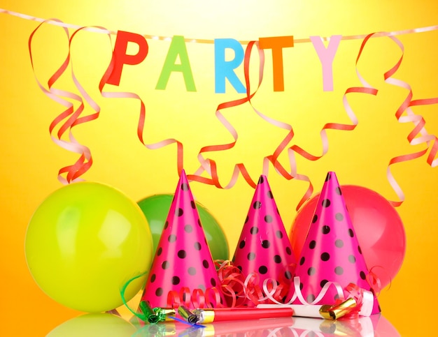 Party items on orange background