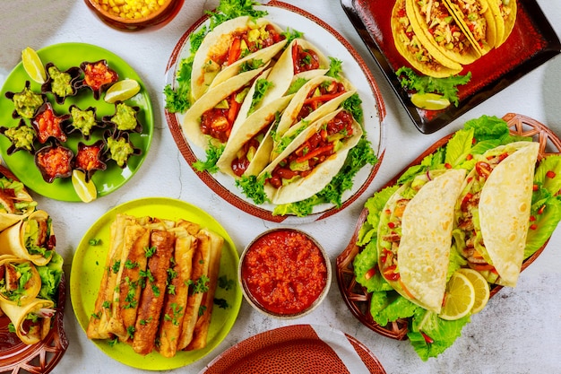 Party table with corn tortillas, taco shells. Mexican cuisine.