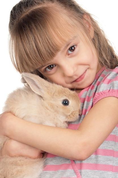 Pasen concept afbeelding Portret van gelukkig klein meisje met schattig konijn op witte achtergrond