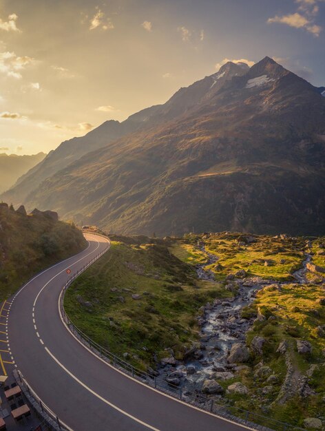 A pass road in the mountains towards sunset