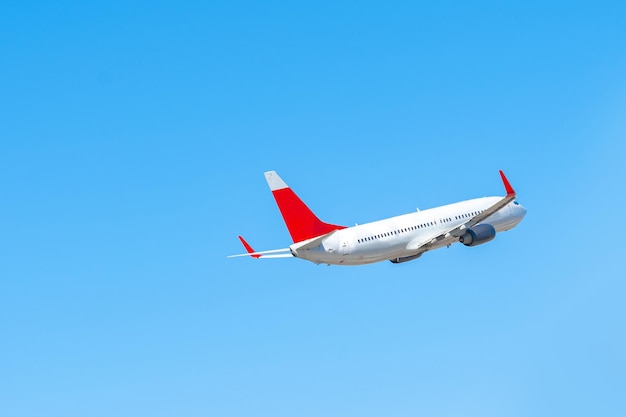 Passenger airplane flying against clear blue sky