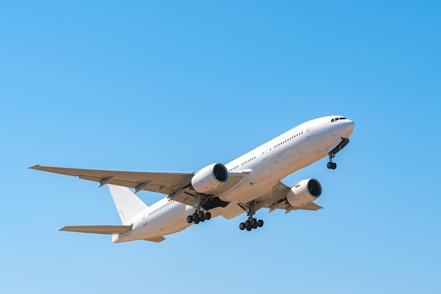 Passenger airplane flying against clear blue sky