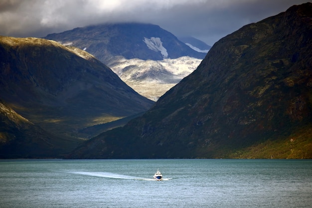 Passenger boat sailing on the lake in the highlands of Scandinavia