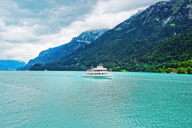 Passenger ferry at Lake Brienz and Brienzer Rothorn mountain at Interlaken in Canton of Bern in Switzerland