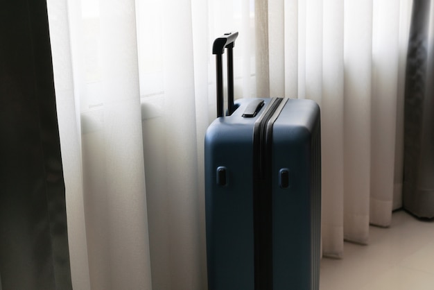 Passenger luggage bag in bed room, ready for vacation