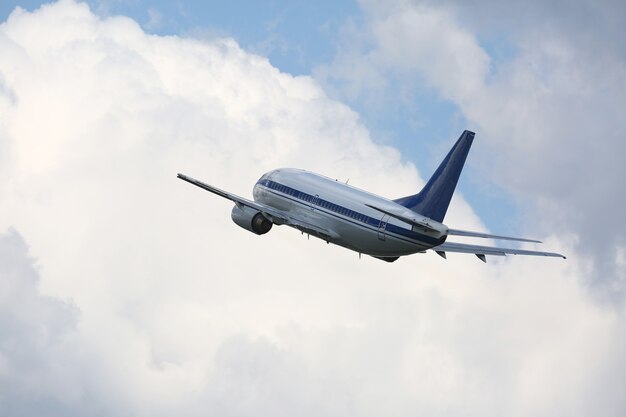 Passenger plane flying in cloudy sky