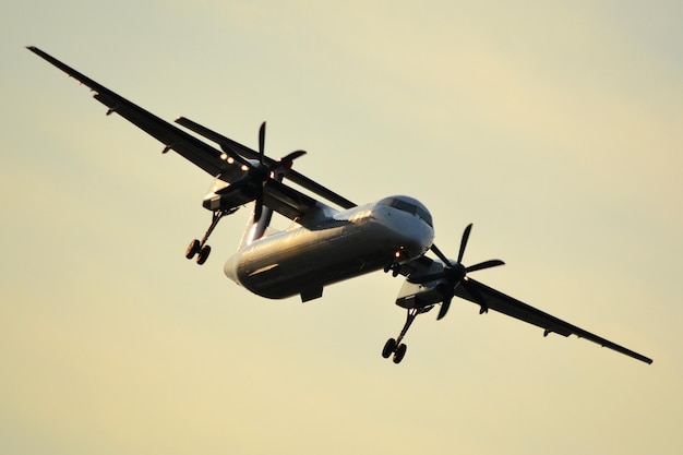 Passenger propeller plane flying in the air