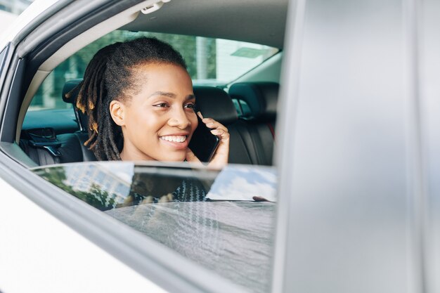 Passenger using phone in car