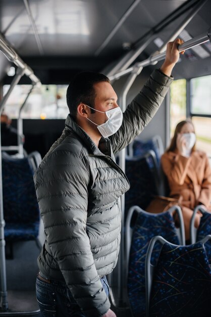passengers on public transport during the coronavirus pandemic keep their distance from each other. protection and prevention covid 19.