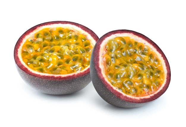 Photo passion fruit cut in half sliced on white