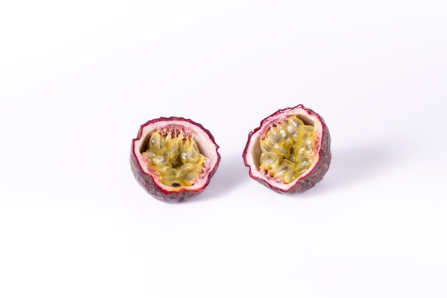 Passion fruit cut in half on the white background