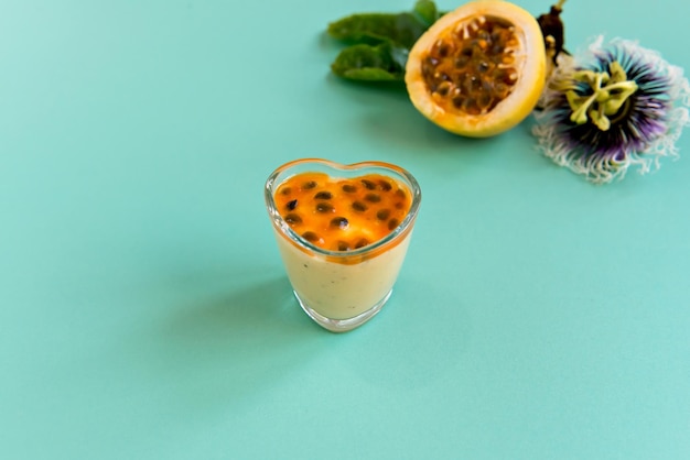 Passion fruit mousse on green background