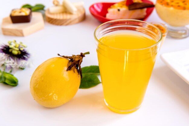 Passion fruit and passion fruit juice on white background