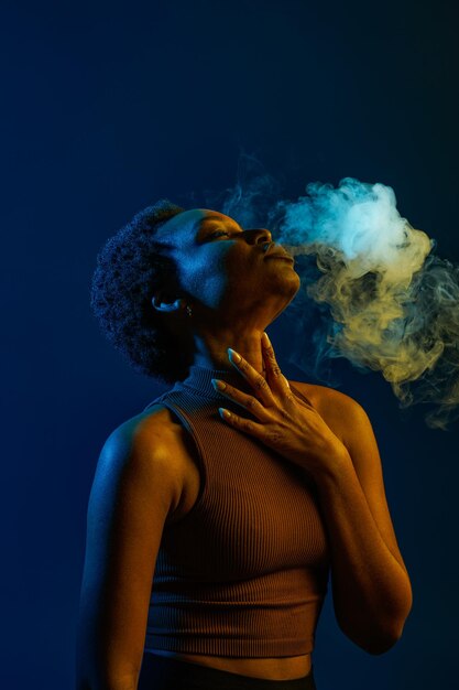 Passion woman blowing smoke curls