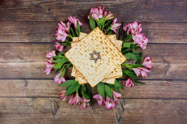 Passover background with matzah and flowers. Jewish holiday.