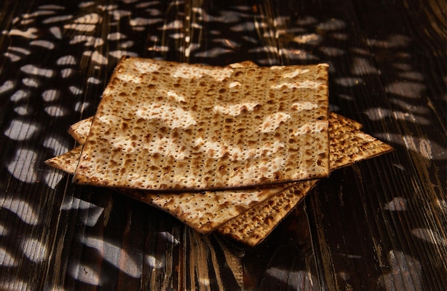 Passover celebration concept Jewish holiday Passover Stack of matzo on a wooden background