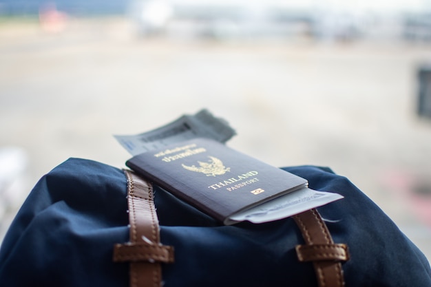 Passport on backpack at airport waiting traveling. 