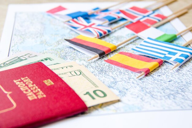 Passport country flags and money on map Budget planning concept