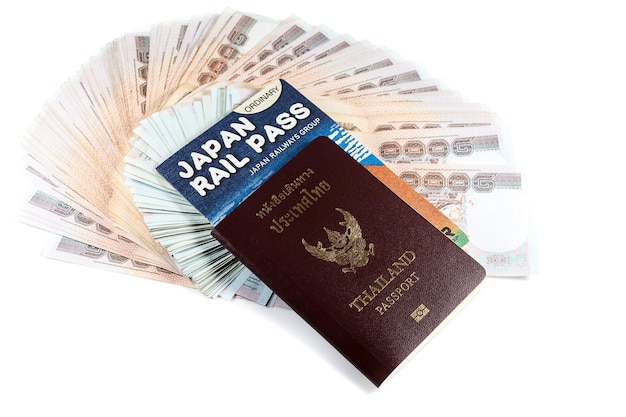 Passport, money and rail pass on white background