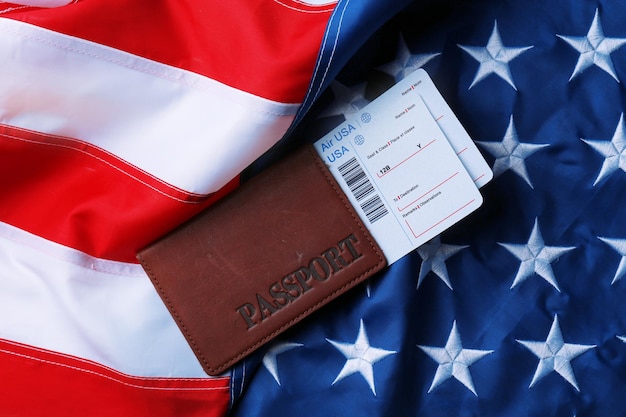 Photo passport tickets lying on american flag background