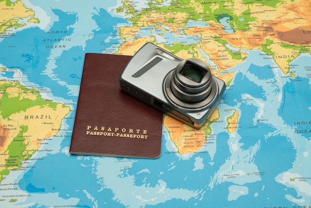 Passport, world map, camera. Travel concept