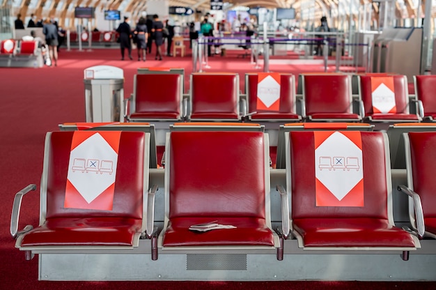 Passports lie on a chair in the waiting room at the airport, social distance. High quality photo