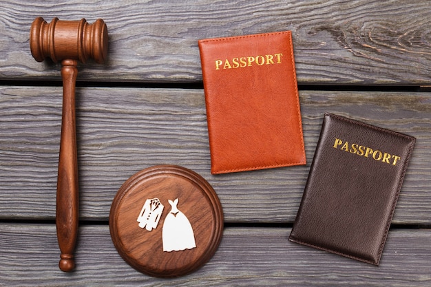 Passports and wooden gavel. Divorce concept top view flat lay.