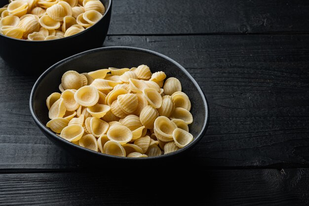 Pasta almentica dried on black wooden table