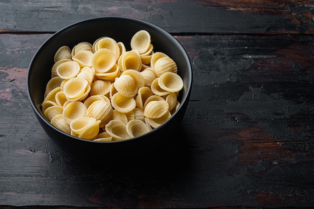 Pasta almentica dried, on old wooden table 