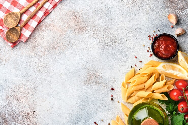 Photo pasta background. pasta rigati, tomato ketchup sauce, olive oil, spices parsley and fresh tomatoes.