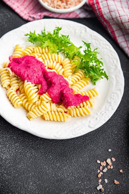 pasta beet sauce vegetable fusilli beetroo fresh food meal snack vegetarian food on the table