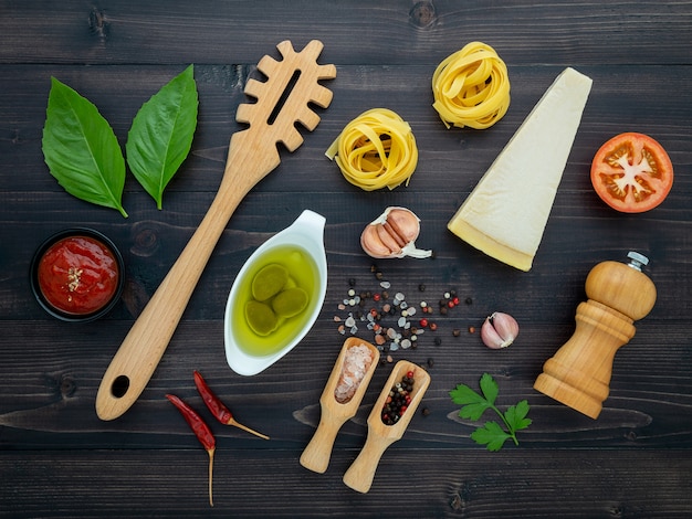 The  pasta on black wooden background. 