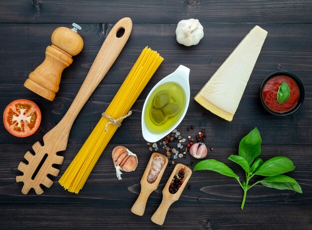 The  pasta on black wooden background. 