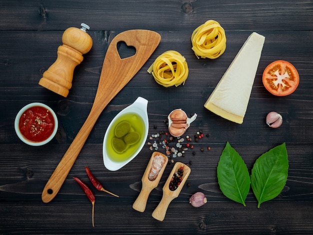 The  pasta on black wooden background. 