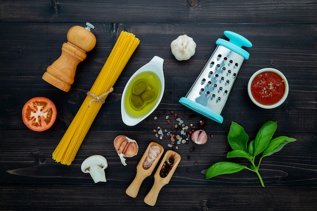 The  pasta on black wooden background. 