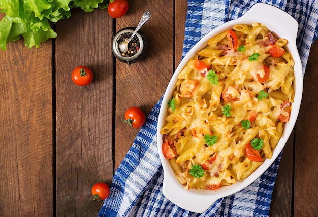 Pasta casserole, tomato, bacon and cheese