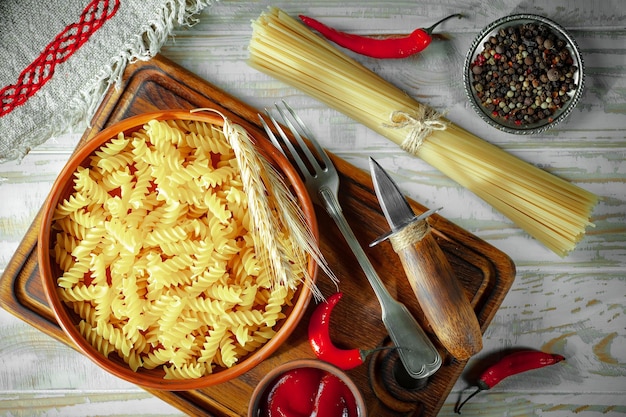 Pasta in composition with vegetables in the kitchen