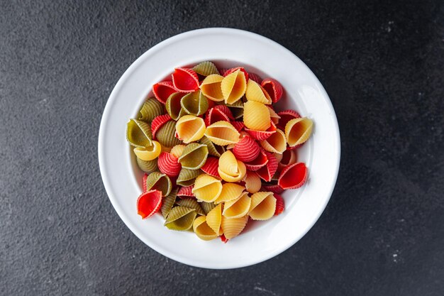 pasta conchiglie multicolored colorful mix healthy meal food snack on the table copy space food 