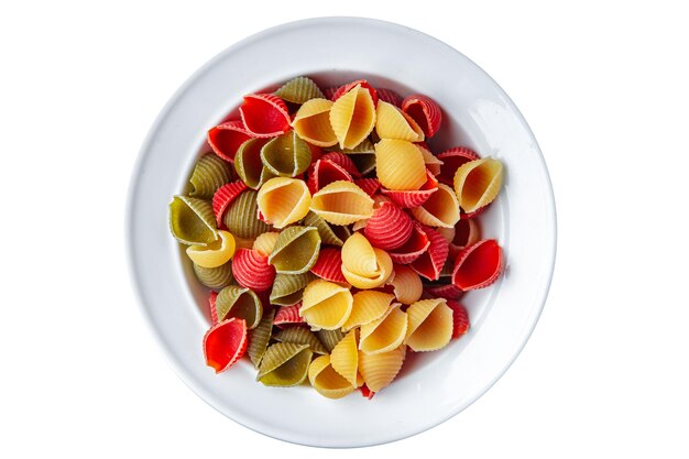 Pasta conchiglie raw colored mix  meal food snack on the table copy space food background